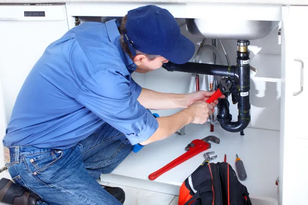 a male plumber fixing a toilet from Emergency Plumber Richardson in Richardson, TX a male plumber fixing a toilet from Emergency Plumber Richardson in Richardson, TX
